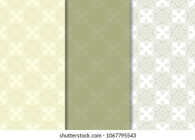 Olive green and white geometric set of vertical seamless patterns for web, textile and wallpapers