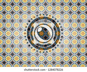 olive icon inside arabesque emblem. arabic decoration.
