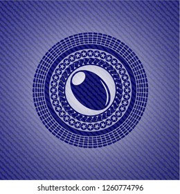olive icon inside badge with denim texture