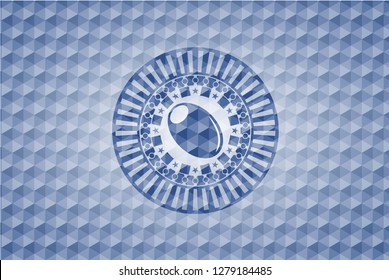 olive icon inside blue badge with geometric pattern.