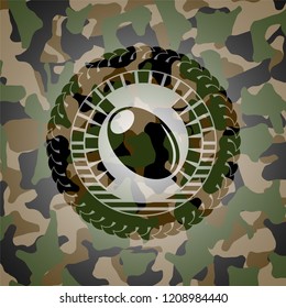 olive icon inside camouflage emblem