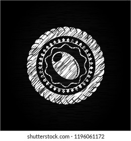 olive icon inside chalk emblem