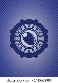 olive icon inside emblem with denim texture