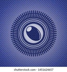 olive icon inside emblem with jean background