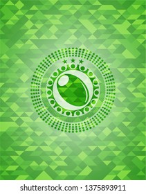 olive icon inside green emblem with triangle mosaic background