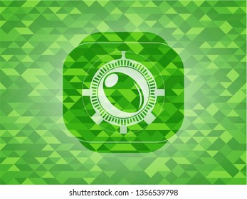 olive icon inside green mosaic emblem