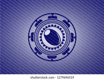 olive icon inside jean or denim emblem or badge background