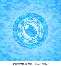 olive icon inside light blue mosaic emblem