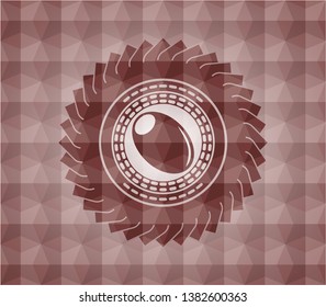 olive icon inside red seamless badge with geometric pattern.