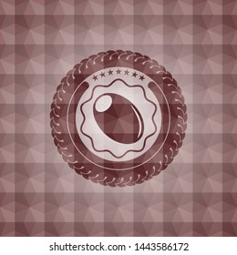 olive icon inside red seamless emblem or badge with abstract geometric pattern background.