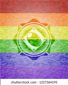 olive icon on mosaic background with the colors of the LGBT flag