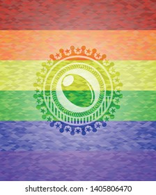olive icon on mosaic background with the colors of the LGBT flag