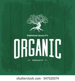 Olive tree vintage logo concept isolated on green wooden background. Web infographic organic product retro pictogram. Premium quality grunge threadbare wood texture illustration mockup.
