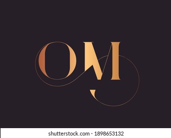 OM monogram logo.Abstract calligraphic signature icon.Letter o and letter m.Lettering sign isolated on dark background.Alphabet initials.Metallic gold uppercase wedding characters and swirl element.