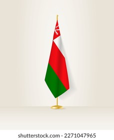 Oman flag on a flag stand. Vector illustration.