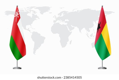 Oman and Guinea Bissau flags for official meeting against background of world map.