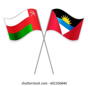 Omani and Antiguan crossed flags. Oman combined with Antigua and Barbuda isolated on white. Language learning, international business or travel concept.