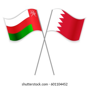 Omani and Bahraini crossed flags. Oman combined with Bahrain isolated on white. Language learning, international business or travel concept.