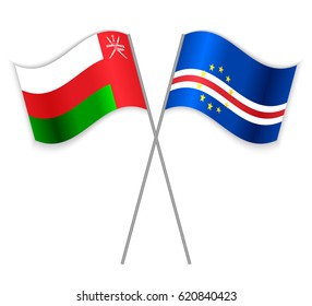 Omani and Cabo Verdean crossed flags. Oman combined with Cabo Verde isolated on white. Language learning, international business or travel concept.
