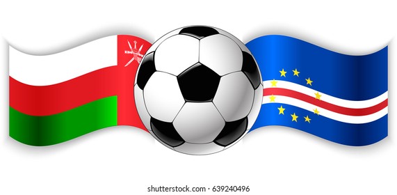 Omani and Cabo Verdean wavy flags with football ball. Oman combined with Cape Verde isolated on white. Football match or international sport competition concept.