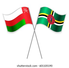 Omani and Dominican crossed flags. Oman combined with Dominica isolated on white. Language learning, international business or travel concept.