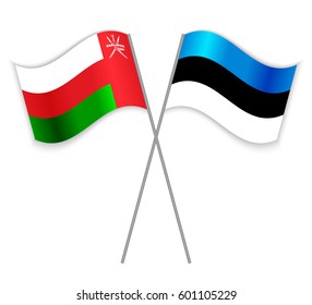 Omani and Estonian crossed flags. Oman combined with Estonia isolated on white. Language learning, international business or travel concept.