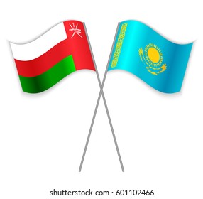 Omani and Kazakh crossed flags. Oman combined with Kazakhstan isolated on white. Language learning, international business or travel concept.