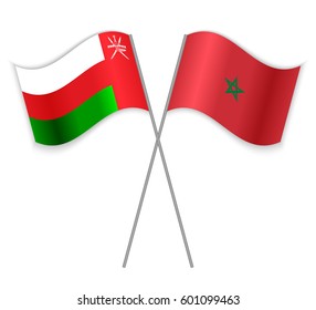 Omani and Moroccan crossed flags. Oman combined with Morocco isolated on white. Language learning, international business or travel concept.