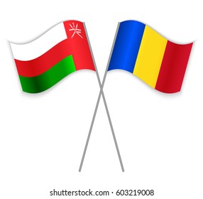 Omani and Romanian crossed flags. Oman combined with Romania isolated on white. Language learning, international business or travel concept.