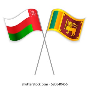 Omani and Sri Lankan crossed flags. Oman combined with Sri Lanka isolated on white. Language learning, international business or travel concept.