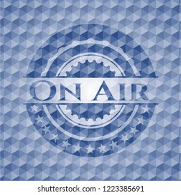 On Air blue badge with geometric pattern background.