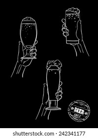 on a black background set of three glasses of beer , holding hands