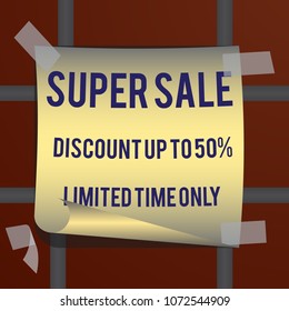 On the brick wall is glued a paper sheet with the inscription Super Sale, discount up to 50%, limited time only.