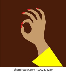 On the chocolate background the gesture of the hand is all right