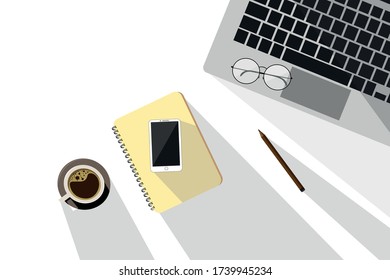 On the desk, the top view, complete with smartphones, glasses and coffee mugs Office desk with accessories