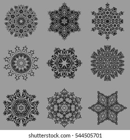 On a gray background. Celebratory vector set with 9 snowflakes. Vector illustration.