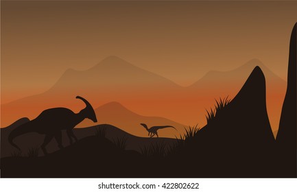 On the hills silhouette eoraptor and parasaurolophus at afternoon