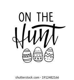 On The Hunt. Black and white lettering with easter eggs. Spring holiday ink lettering for baby Easter For clothing, family decor, Seasons Greeting, postcard, card, invitation