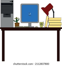 on the table is a computer, a cactus, tea, a lamp and books. student workplace