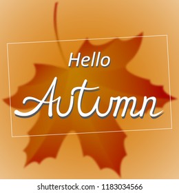 on a warm background autumn leaf and the inscription Hello Autumn
