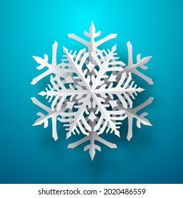 One big Christmas paper snowflake with soft shadow, white on light blue background