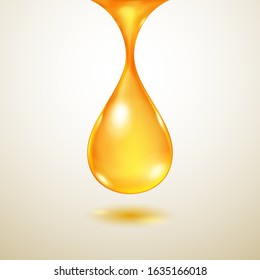 One big realistic translucent water drop in yellow colors with shadow