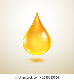 One big realistic translucent water drop in yellow colors with shadow