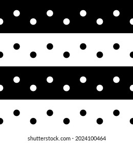En una línea blanca y negra con puntos de polka. Puntos simples y fondo de color opuesto.