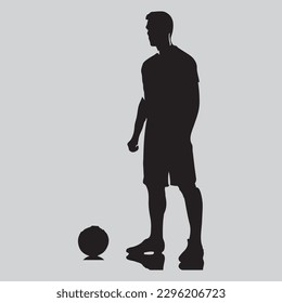 one caucasian soccer player man standing in silhouette