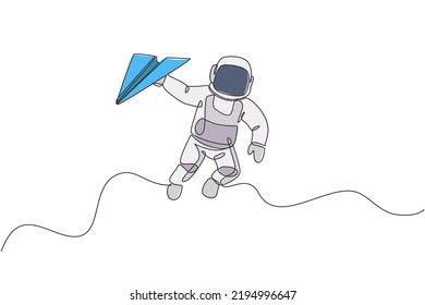 One continuous line drawing of cosmonaut exploring outer space. Astronaut holding paper plane. Fantasy cosmic galaxy discovery concept. Dynamic single line draw design vector illustration graphic