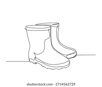Un dibujo de línea continua de botas de agricultor. Botas de goma ilustración de dibujo de contorno. 