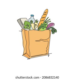 One continuous line drawing of fresh delicious vegetables, milk, baguette, and bread inside paper grocery bag. Staple food concept. Modern single line draw design vector graphic illustration