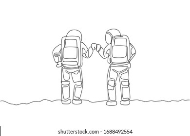 One continuous line drawing of two young happy astronauts giving fist bump gesture in moon surface, rear view. Space man deep space concept. Dynamic single line draw design vector graphic illustration