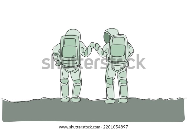 One continuous line drawing of two young
happy astronauts giving fist bump gesture in moon surface, rear
view. Space man deep space concept. Dynamic single line draw design
vector graphic
illustration